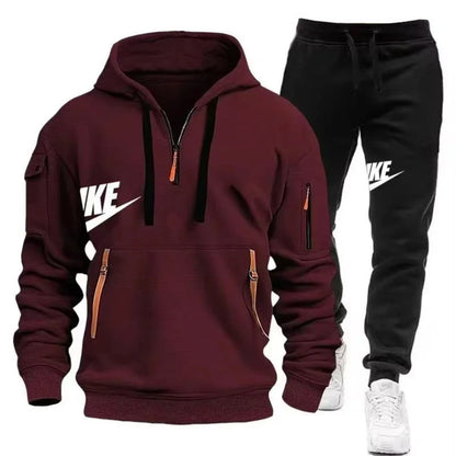 Maroon hoodie and black pants with Nike logo on a white background